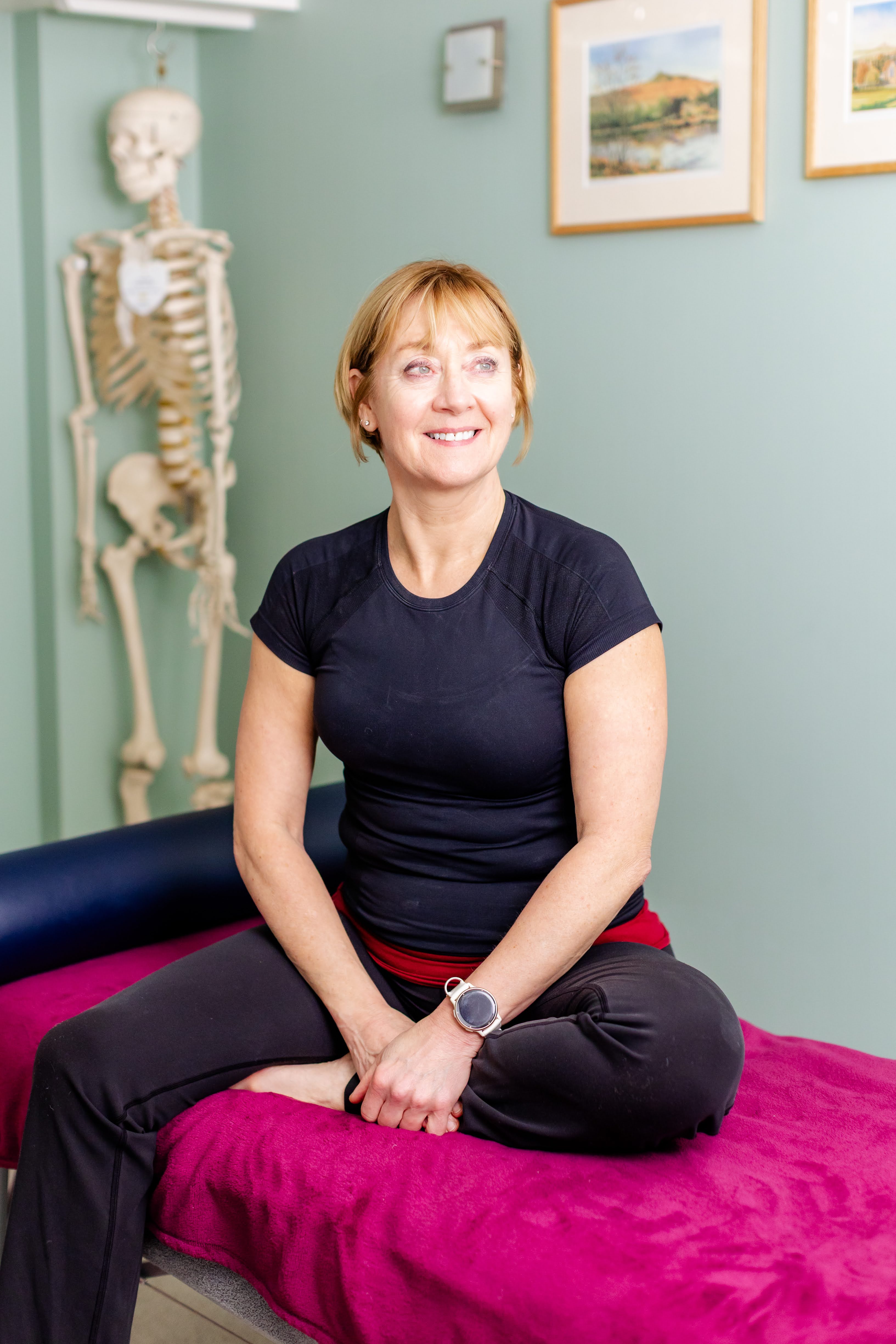Helen Portsmouth seated in her treatment room